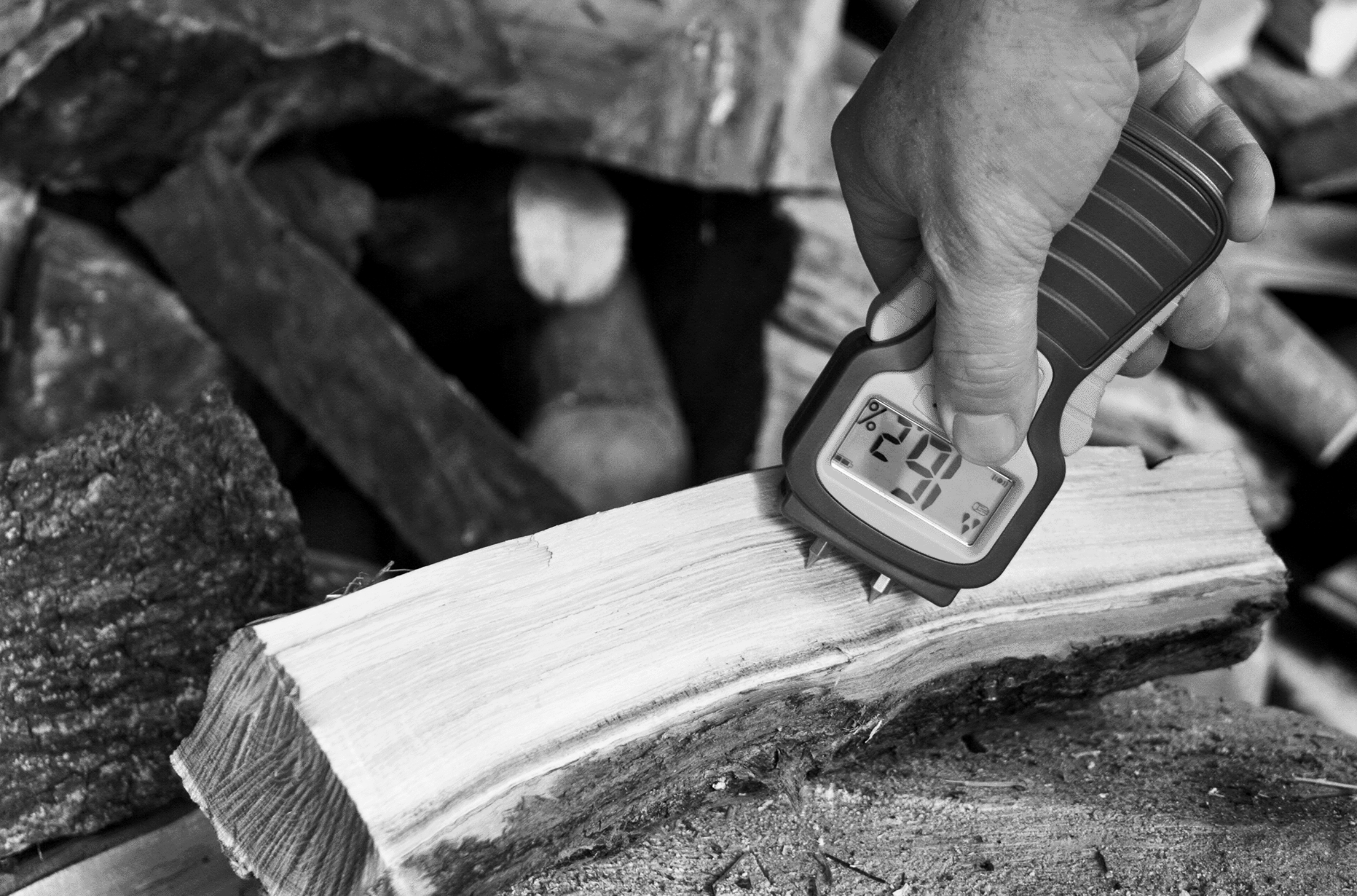 A quality control check on natural material furniture, ensuring proper moisture content.