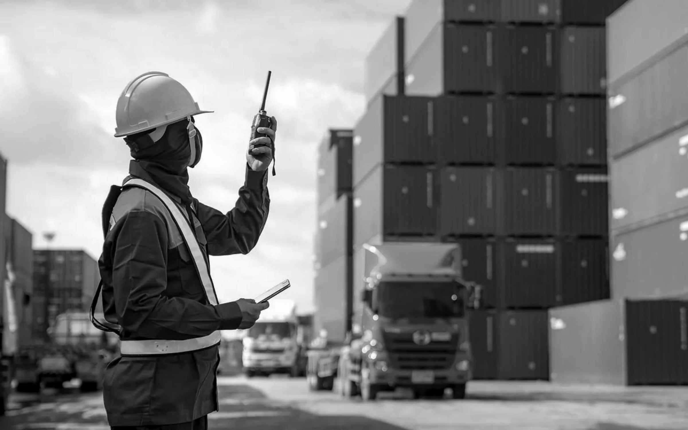 Inspector verifying shipping containers under export compliance regulations and cargo verification process.